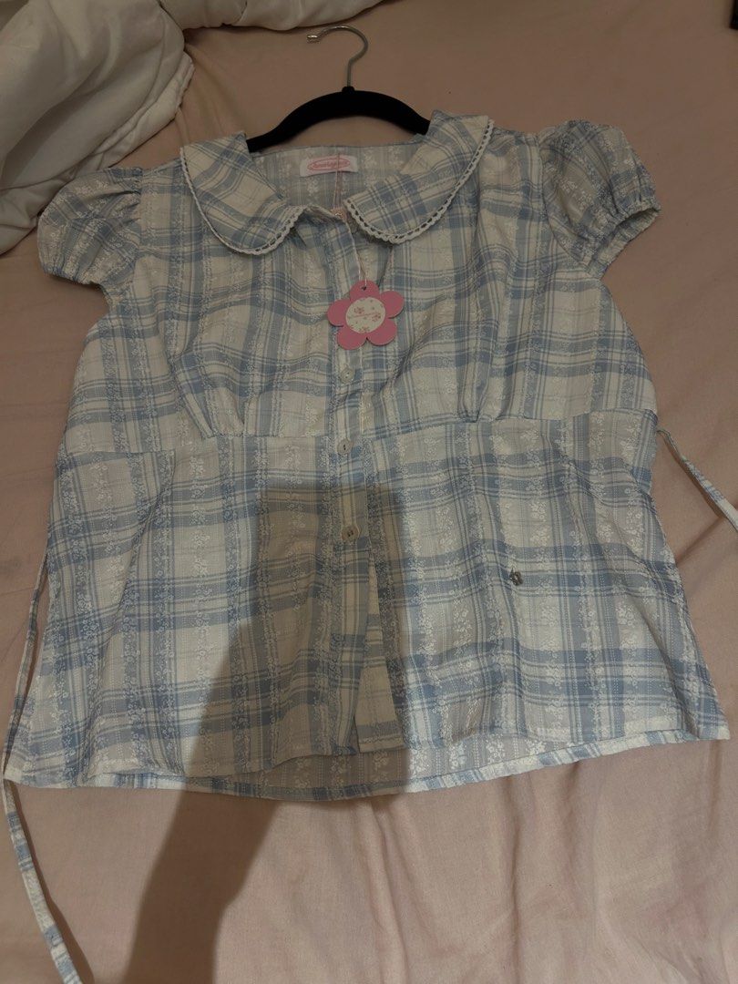 Something Cute Blue Plaid Peter Pan Collar Top (Category: Blouses) located in Manila. Submitted by coquettecosette (Listing ID 1459551786, Image 1). Description: 💙 Blue Blouse Polo 🎀 Sweet blue blouse polo with a classic collar and button-up front ♡ A simple yet feminine piece that’s perfect for everyday wear. Pair it with a skirt or jeans for a cute, effortless look ✧ .