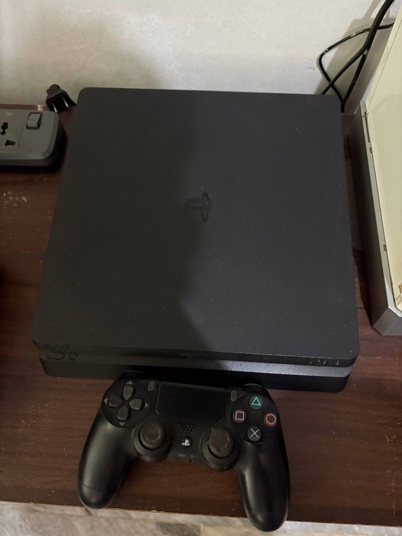 Sony PlayStation 4 Slim Console with Controller and Games (Category: PlayStation) located in Binan City. Submitted by vryb3rryy (Listing ID 1459507669, Image 3). Description: Selling a black PS4 Slim console. Includes one DualShock 4 controller. Games shown are included: NBA 2K19, NBA 2K17, Lego Jurassic World, The Walking Dead: The Complete First Season, God of War III Remastered, Disney Pixar Toy Story 3, Wipeout Pure, Monster Hunter Portable, 