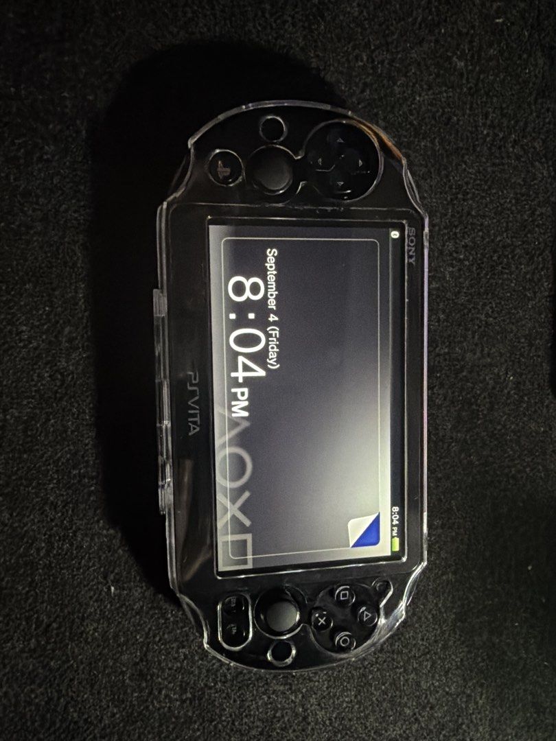 Sony PS Vita PCH-2000 (Category: Other Gadgets) located in San Fernando. Submitted by espiritujed45 (Listing ID 1459608967, Image 2). Description: - Sony PS Vita PCH-2000 model - Includes a clear protective case - Screen is clean and scratch-free - Buttons and joysticks are in excellent working condition - Ready for immediate gaming -64gb sd card -Jailbroken Unli Download games - with charger and pouch - Can ship via lbc or lalamove -can vc to le