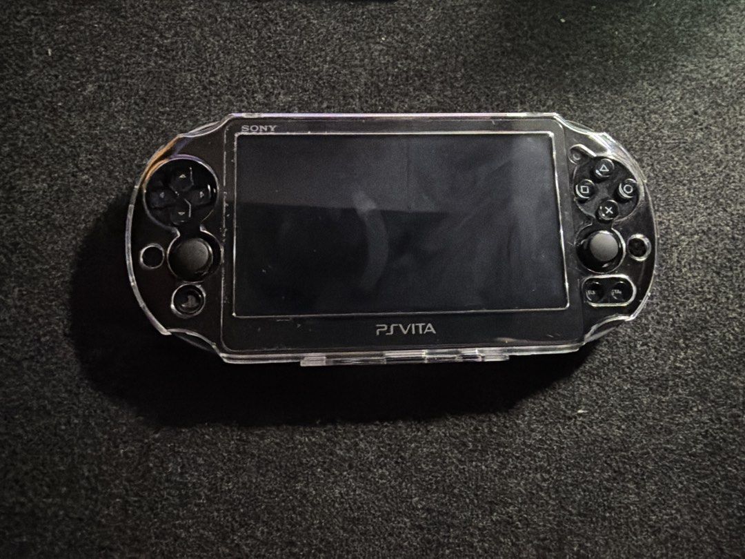 Sony PS Vita PCH-2000 (Category: Other Gadgets) located in San Fernando. Submitted by espiritujed45 (Listing ID 1459608967, Image 1). Description: - Sony PS Vita PCH-2000 model - Includes a clear protective case - Screen is clean and scratch-free - Buttons and joysticks are in excellent working condition - Ready for immediate gaming -64gb sd card -Jailbroken Unli Download games - with charger and pouch - Can ship via lbc or lalamove -can vc to le
