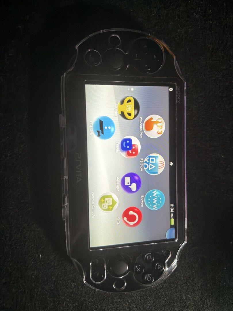 Sony PS Vita PCH-2000 (Category: Other Gadgets) located in San Fernando. Submitted by espiritujed45 (Listing ID 1459608967, Image 3). Description: - Sony PS Vita PCH-2000 model - Includes a clear protective case - Screen is clean and scratch-free - Buttons and joysticks are in excellent working condition - Ready for immediate gaming -64gb sd card -Jailbroken Unli Download games - with charger and pouch - Can ship via lbc or lalamove -can vc to le