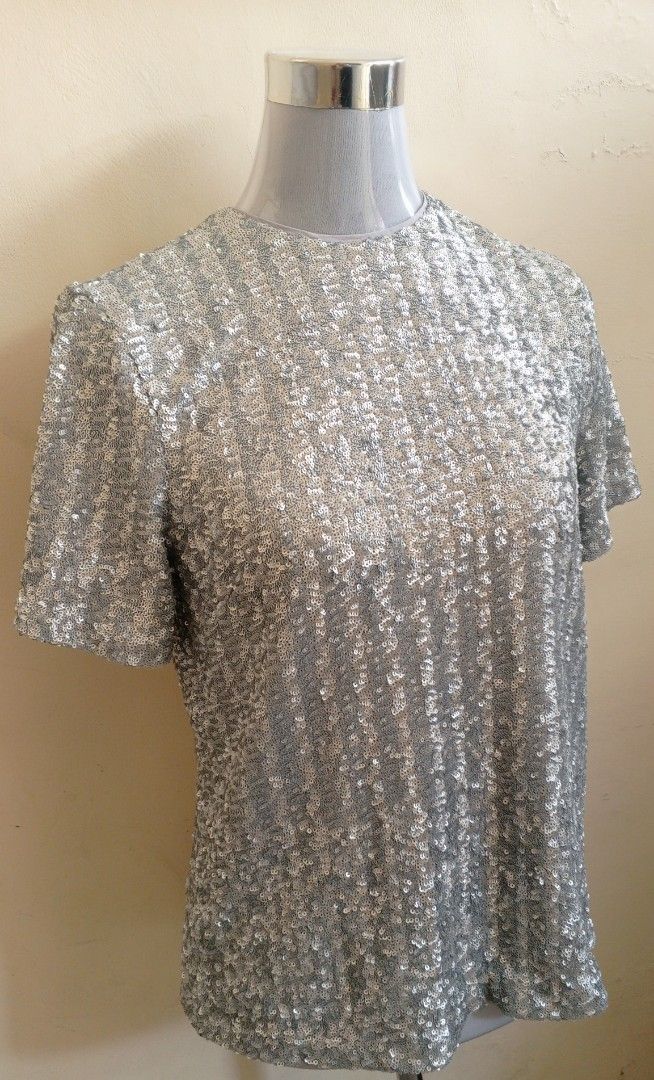 Sparkly Silver Sequin Short Sleeve Top (Category: Blouses) located in Cebu City. Submitted by violacloset (Listing ID 1459492726, Image 3). Description: Measurements: length: 23 1/2 in bust: 19 1/2 in waist: 19 1/2 in the material is stretchable.