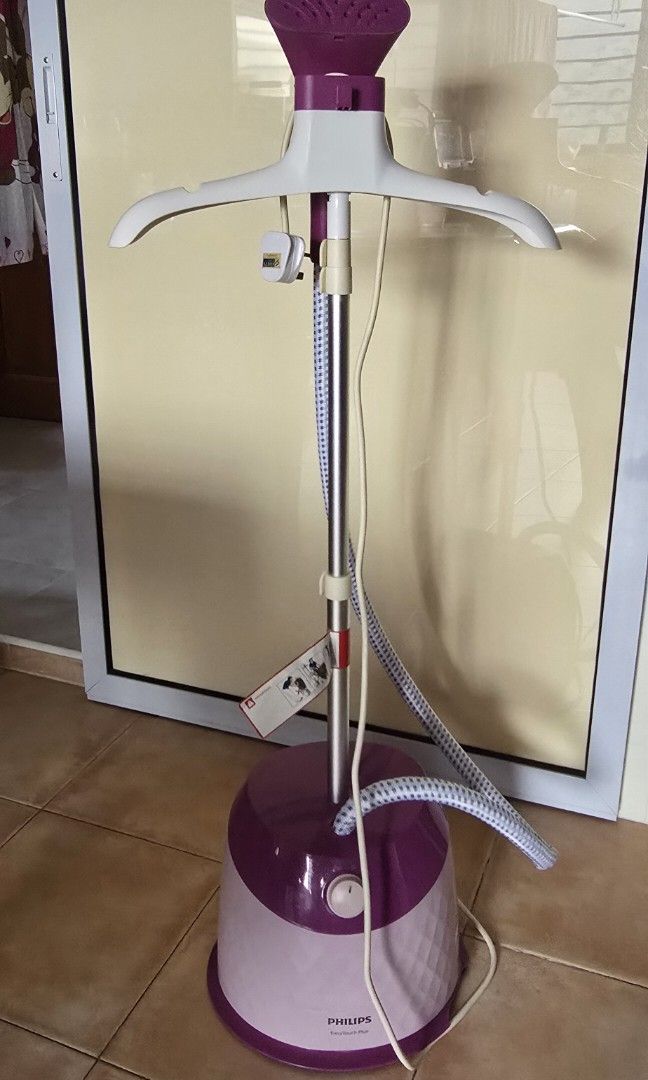 Steamer (Category: Irons & Steamers) located in Singapore. Submitted by a.low888 (Listing ID 1459589727, Image 3). Description: - Philips garment steamer - Color: Purple and White - Condition: Excellent, like new - Features: Easy wrinkle removal, includes hanger and steam hose - Convenient for quick garment care - below got crack ( please see picture - Meetup at Kembangan MRT.