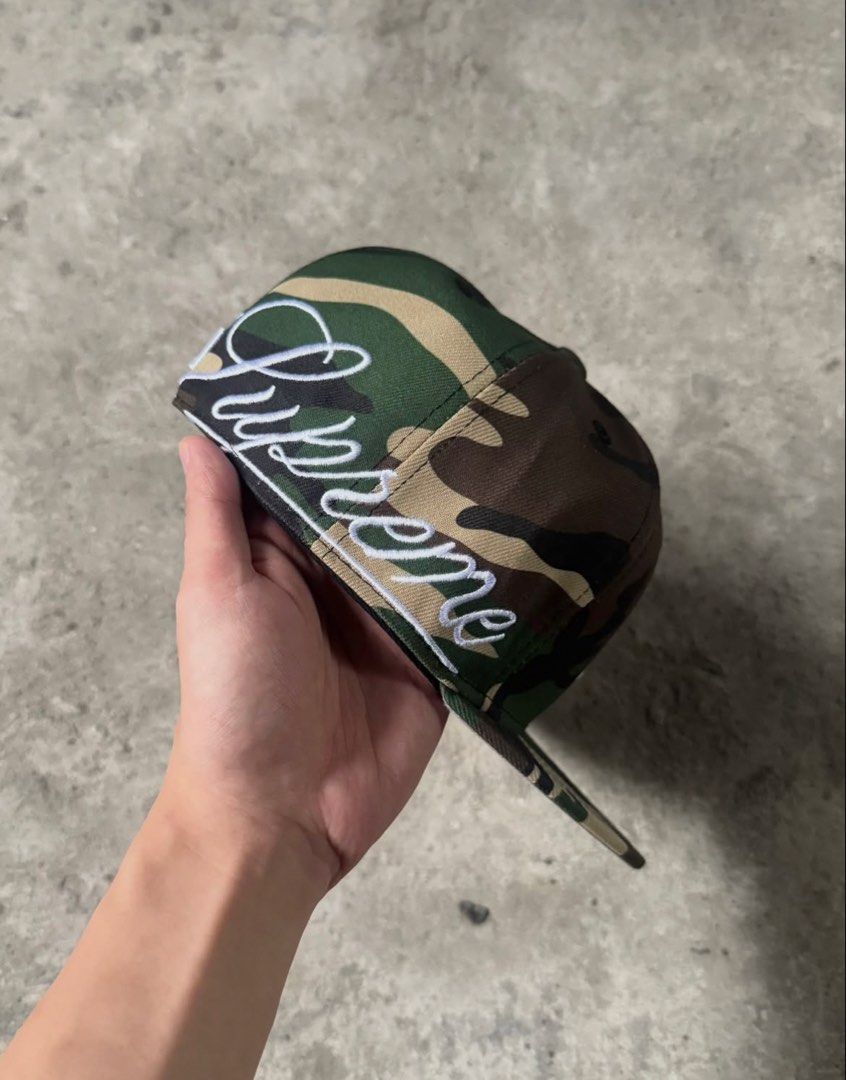 Supreme New Era Yankees Camo Fitted Hat (Category: Caps & Hats) located in Manila. Submitted by ch1lleroli82692 (Listing ID 1459606220, Image 2). Description: - Supreme x New Era collaboration - Classic camouflage pattern - White Supreme script logo on the side - New York Yankees logo on the front - New Era 59FIFTY fitted cap - Brand new with New Era tag attached - Perfect for collectors and streetwear enthusiasts.