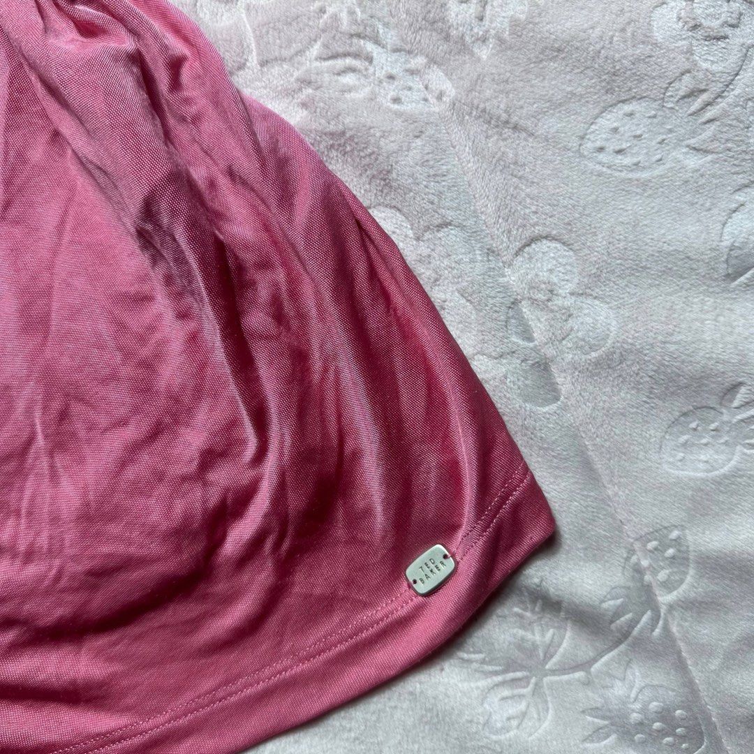 TED BAKER Pink Glitter y2k Strap Top (Category: Sleeveless) located in San Fernando. Submitted by rianne_von (Listing ID 1459605809, Image 2). Description: W: 12 in L: 17 in info: ✧ vibrant pink fitted top w/ soft ruched detailing throughout ✧ sparkly metallic straps w/ statement cross-back design + Ted Baker hardware detail ✧ excellent thrifted condition; no holes, stains, or major flaws observed ✧ color may vary slightly due to lighting.