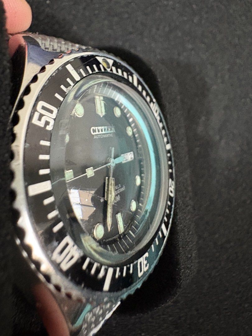 The iconic Citizen Paddle Hands 51-2273 (Category: Men's Watches) located in Quezon City. Submitted by rentoti (Listing ID 1459518430, Image 2). Description: This is a classic. A highly collectible vintage diver featuring the iconic signature paddle hands. Condition & Details: 100% all original head (dial, hands, bezel, case, and crown). Only the strap has been replaced with a comfortable grey fabric/textile strap. Keeps accurate time and functio
