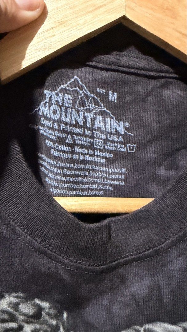 The Mountain Dinosaur T-Shirt Size M (Category: Tshirts & Polo Shirts ) located in Batangas. Submitted by cjayf (Listing ID 1459628979, Image 3). Description: - Cool tie-dye t-shirt - Features a fierce T-Rex graphic - Brand: The Mountain - Size: Medium - Material: 100% Cotton - Origin: Made in Mexico, dyed and printed in the USA - Unique all-over print - Perfect for dinosaur lovers.
