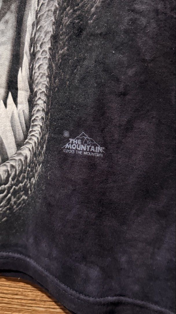 The Mountain Dinosaur T-Shirt Size M (Category: Tshirts & Polo Shirts ) located in Batangas. Submitted by cjayf (Listing ID 1459628979, Image 2). Description: - Cool tie-dye t-shirt - Features a fierce T-Rex graphic - Brand: The Mountain - Size: Medium - Material: 100% Cotton - Origin: Made in Mexico, dyed and printed in the USA - Unique all-over print - Perfect for dinosaur lovers.