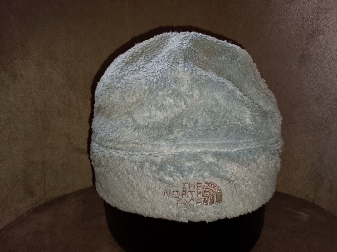 The North Face Beanie (Category: Hats & Beanies) located in Binangonan. Submitted by yuristalin888 (Listing ID 1459575373, Image 2). Description: Stay warm and cozy on chilly days with this light blue fleece beanie from The North Face. Crafted from a plush, fuzzy material for maximum warmth and comfort, it features a folded cuff accented with the brand's signature logo neatly embroidered in silver stitch. Perfect for outdoor adventures or casual 