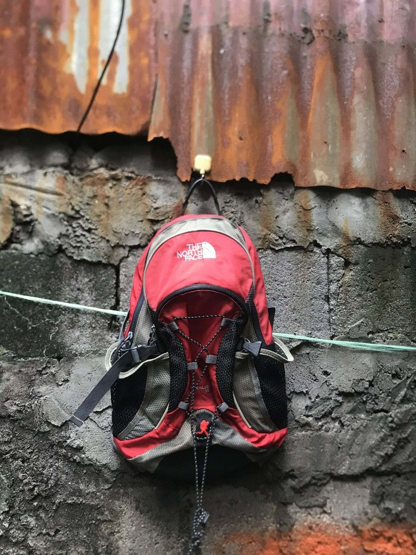 The North Face Red & Grey Backpack (Category: Backpacks) located in Quezon City. Submitted by carlodepaz (Listing ID 1459605962, Image 1). Description: tnf bag pack need wash 7.5/10 condition 450 free ship via jnt.