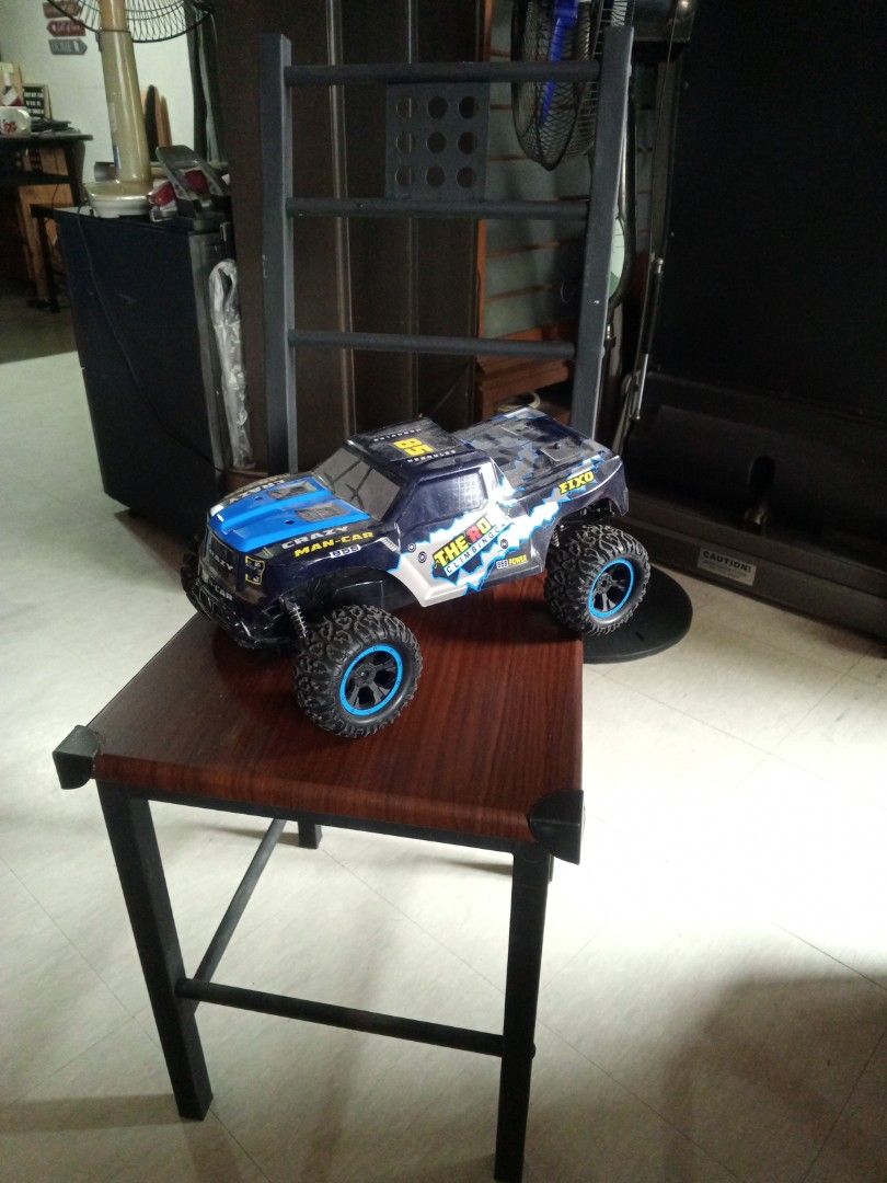The Rock Climbing Car RC Toy (Category: Remote Control Toys) located in Las Pinas. Submitted by plainhavoc69 (Listing ID 1459508741, Image 1). Description: - Cool RC climbing car - Striking blue and black color scheme with yellow and silver accents - Designed for off-road action NO REMOTE Control - Features chunky tires for excellent grip - Ideal for outdoor fun and adventures.