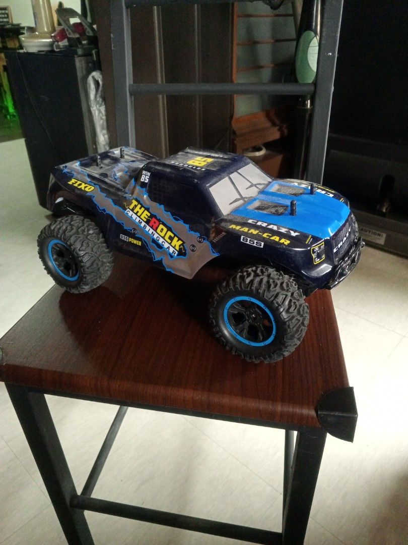 The Rock Climbing Car RC Toy (Category: Remote Control Toys) located in Las Pinas. Submitted by plainhavoc69 (Listing ID 1459508741, Image 2). Description: - Cool RC climbing car - Striking blue and black color scheme with yellow and silver accents - Designed for off-road action NO REMOTE Control - Features chunky tires for excellent grip - Ideal for outdoor fun and adventures.