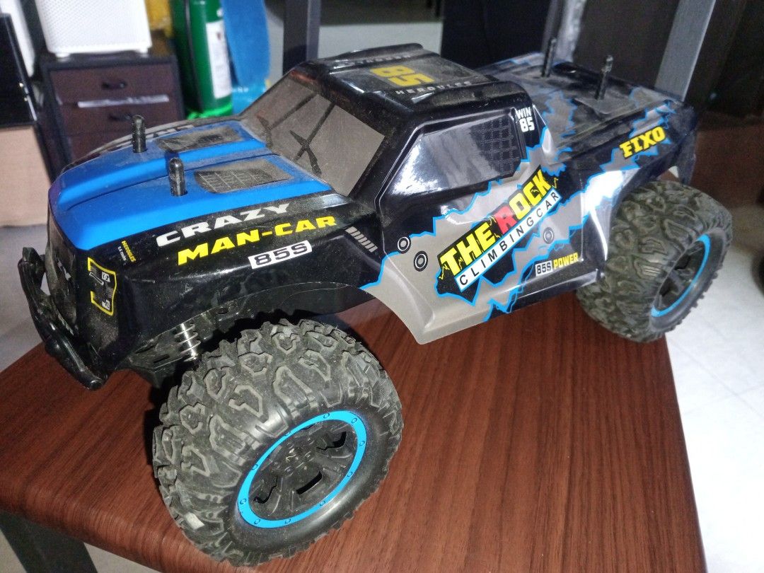 The Rock Climbing Car RC Toy (Category: Remote Control Toys) located in Las Pinas. Submitted by plainhavoc69 (Listing ID 1459508741, Image 3). Description: - Cool RC climbing car - Striking blue and black color scheme with yellow and silver accents - Designed for off-road action NO REMOTE Control - Features chunky tires for excellent grip - Ideal for outdoor fun and adventures.
