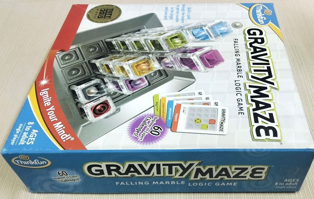 ThinkFun Gravity Maze Falling Marble Logic Game (Category: Board Games & Puzzles) located in Taguig. Submitted by Bloomscorner1 (Listing ID 1459531390, Image 3). Description: - a Think Fun Gravity Maze Logic game to get the marble to the target. - Ignite your mind and tests your reasoning skills. - Build a path through the towers to get the marble to the target - 60 challenges from beginner to expert. - Suitable for ages 8 to adult. - Single play