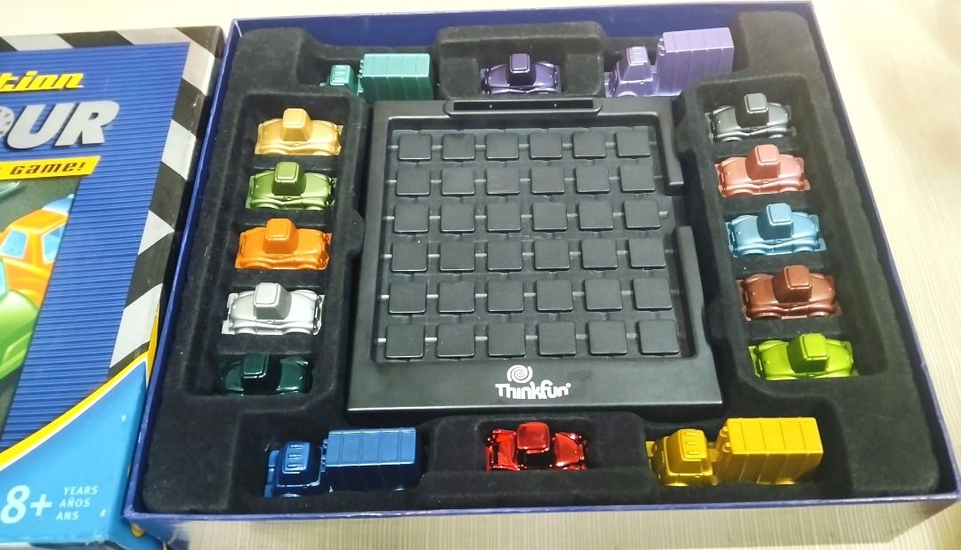ThinkFun Rush Hour Deluxe Edition Traffic Jam Logic Game (Category: Board Games & Puzzles) located in Taguig. Submitted by Bloomscorner1 (Listing ID 1459538404, Image 3). Description: - Rush Hour Deluxe Edition: The ultimate traffic jam game. - Features 60 select challenges. - A fun logic puzzle suitable for all ages. - Excellent for developing problem-solving skills. - All game pieces and the board are included. - Challenge cards are also part o