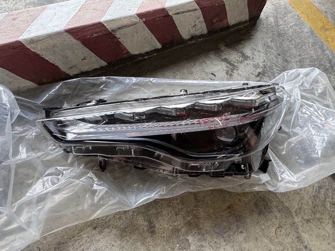 Toyota Corolla Cross GRS Left headlight (Category: Lightings, Horns, and other Electrical Parts and Accessories) located in Quezon City. Submitted by gonzylla (Listing ID 1459592844, Image 1). Description: Toyota Corolla Cross GRS headlight (2025 model) Left side (driver side) With slight scratch (see photo) Brand new in Toyota: ₱1xx,xxx Pick up in Eastwood .