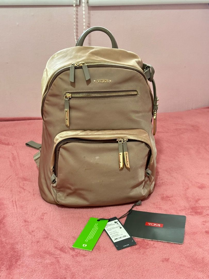 Tumi Backpack Harper Bag (Category: Backpacks) located in Caloocan City. Submitted by gandara12345678 (Listing ID 1459600446, Image 2). Description: - Tumi Harper backpack - Metallic Rosa Color - Multiple interior compartments for organization - Smooth, reliable zippers - Adjustable straps for comfortable wear - Laptop can fit - Ideal for everyday use or travel -with free 2 blank patches (bought in Tumi Greenbelt).