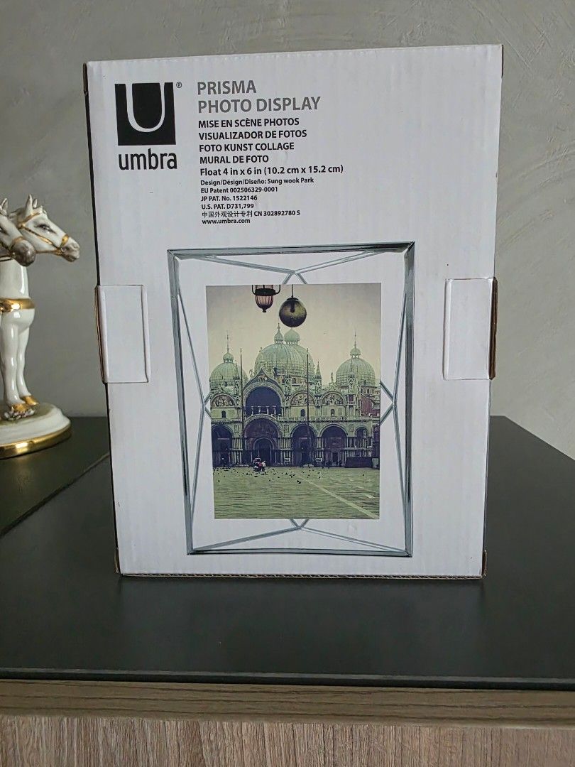Umbra Prisma Photo Display Frame (Category: Frames & Pictures) located in Manila. Submitted by tch_86 (Listing ID 1459491917, Image 2). Description: Umbra Prisma Photo Display Frame - 4x6" - Modern geometric design - Clear glass panels with a sleek metal frame .