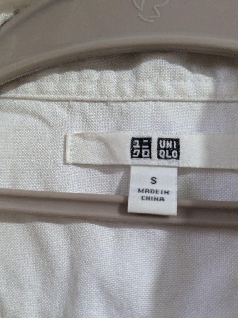 Uniqlo tops bundle (Category: Shirts) located in San Fernando. Submitted by mamamimimoo (Listing ID 1459542513, Image 3). Description: - Originally for men - Size S on tag - Bundle includes 2 long-sleeve shirts. - Uniqlo Navy blue t-shirt with white stripes. - White Uniqlo button-up shirt.
