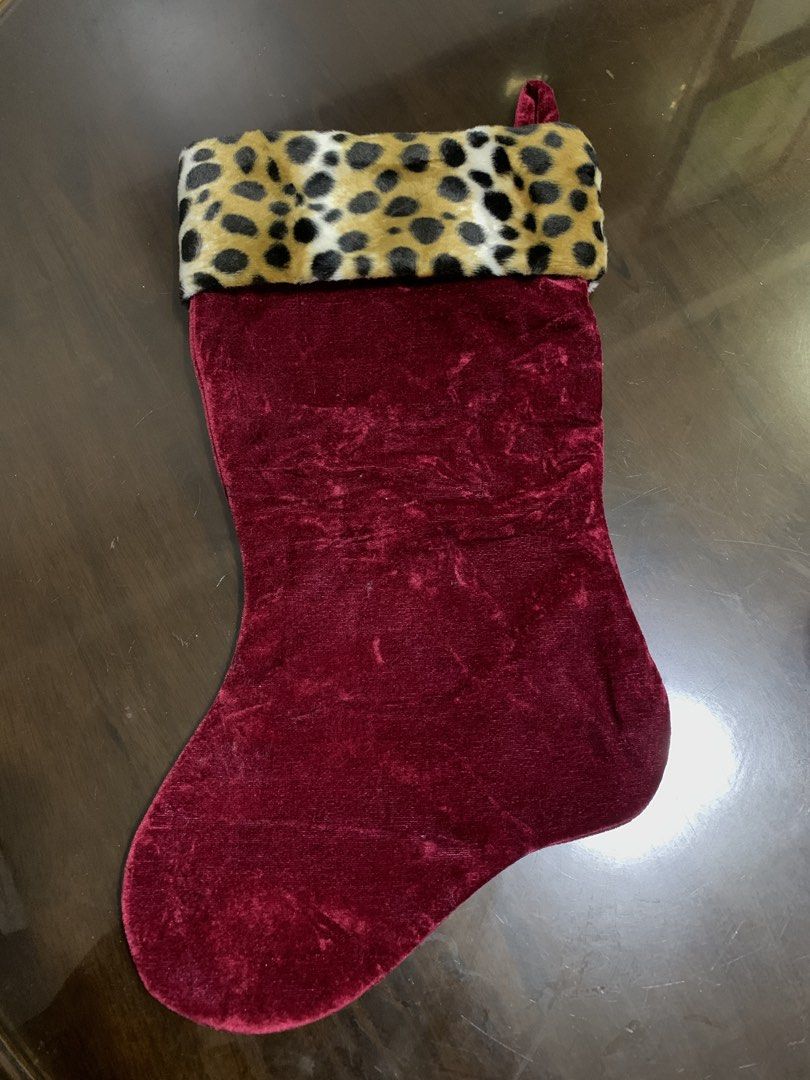 Velvet Christmas Stocking with Leopard Print Cuff (Category: Other Home Decor) located in Rizal. Submitted by shop_ms.lai (Listing ID 1459620670, Image 2). Description: - Red velvet Christmas stocking - Features a fun leopard print faux fur cuff - Ideal for filling with gifts and treats - Adds a festive touch to your mantelpiece - Great for both kids and adults -For Christmas - 1 pc only.
