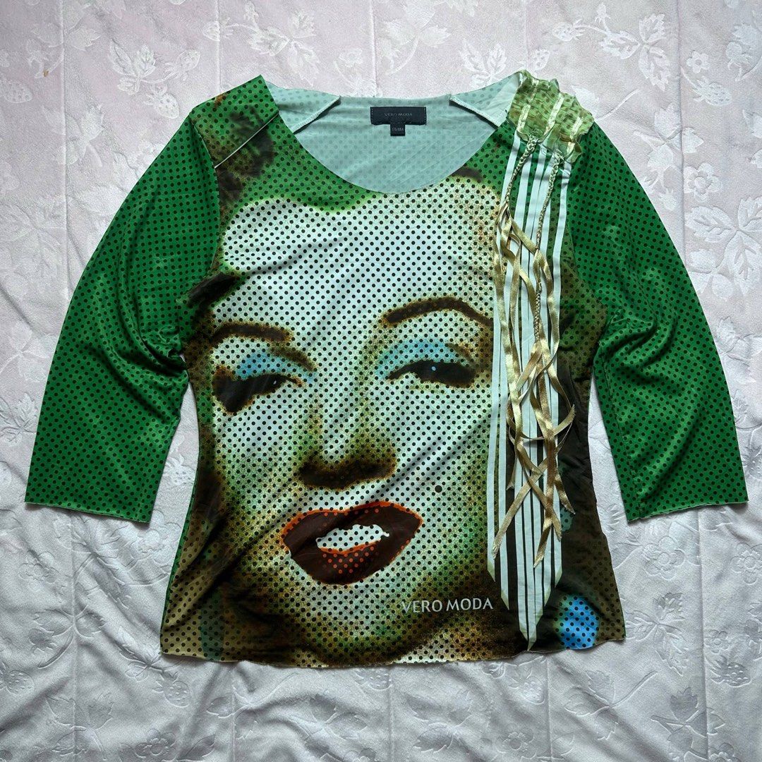 VERO MODA Pop Art Graphic Top (Category: Longsleeves) located in San Fernando. Submitted by rianne_von (Listing ID 1459623407, Image 1). Description: Size 170/88A on tag W: 17.5 in L: 23 in info: ✧ bold green pop-art top w/ oversized woman portrait graphic ✧ dotted print throughout w/ statement geometric detailing + 3/4 sleeves ✧ excellent thrifted condition; no holes, stains, or major flaws observed ✧ color may vary slightly due to lighting .