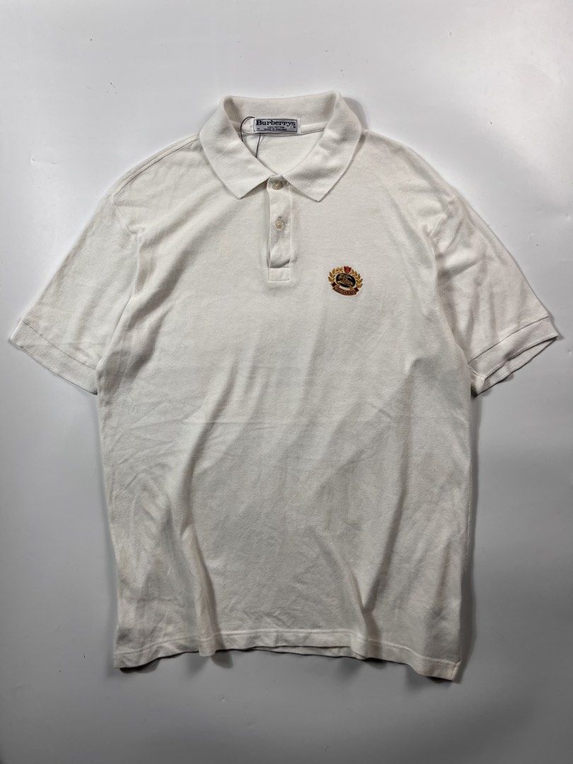 Vintage Burberry poloshirt white (Category: Tshirts & Polo Shirts ) located in Iloilo. Submitted by ukayhunter.ilo (Listing ID 1459631430, Image 1). Description: Vintage Burberry poloshirt white Size medium Measurement 21x28.5 Noflaws Need wash.