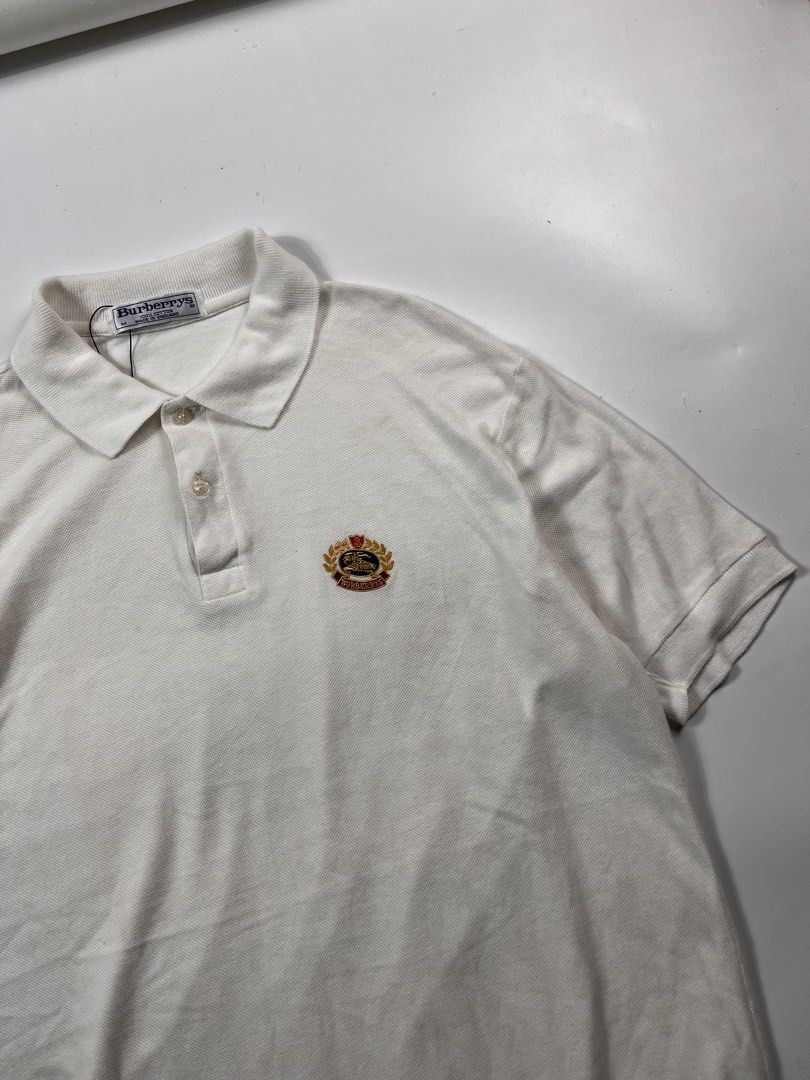 Vintage Burberry poloshirt white (Category: Tshirts & Polo Shirts ) located in Iloilo. Submitted by ukayhunter.ilo (Listing ID 1459631430, Image 2). Description: Vintage Burberry poloshirt white Size medium Measurement 21x28.5 Noflaws Need wash.