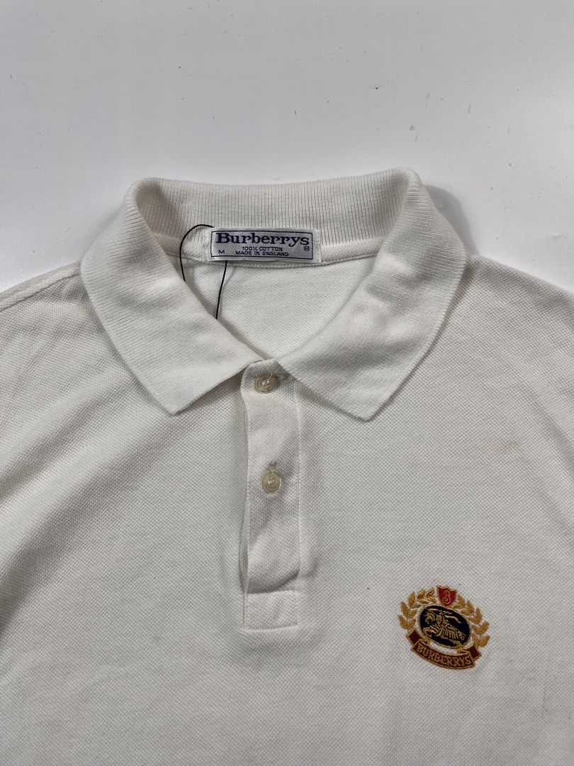 Vintage Burberry poloshirt white (Category: Tshirts & Polo Shirts ) located in Iloilo. Submitted by ukayhunter.ilo (Listing ID 1459631430, Image 3). Description: Vintage Burberry poloshirt white Size medium Measurement 21x28.5 Noflaws Need wash.