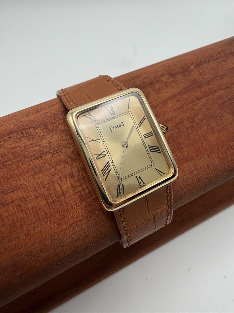 Vintage Piaget Tank Solid 18k Gold Manual Wind (Category: Luxury Watches) located in Manila. Submitted by rj_authenticwatchesandmore (Listing ID 1459656665, Image 1). Description: Vintage Piaget Tank - 1970s watch - Solid 18k Gold Case, including buckle - Cabochon crown - reference 9298 - weight of watch 30g (including strap) - case dimension 24mm x 30mm - manual wind movement In very good condition, some dial patina, runs good, keeps time Watch 