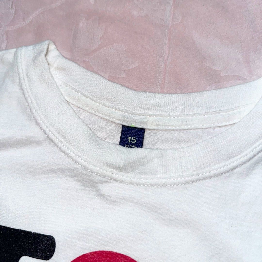 White Graphic Baby Tee (Category: Shirts) located in San Fernando. Submitted by rianne_von (Listing ID 1459613030, Image 3). Description: Size 15 on tag W: 14.8 in L: 18 in info: ✧ white fitted baby tee w/ bold “I ♥ HUA HIN” statement graphic ✧ contrast black lettering + vibrant red heart for a playful tourist/Y2K look ✧ excellent thrifted condition; no holes, stains, or major flaws observed ✧ color may vary slightly due to lighting.