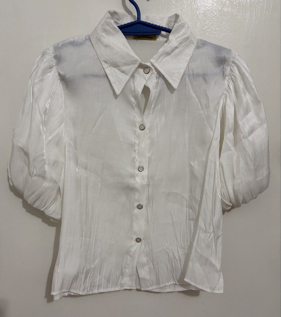White Puff Sleeve Button-Up Blouse (Category: Blouses) located in Manila. Submitted by czarmorales (Listing ID 1459620930, Image 1). Description: 🤍 WHITE SHEER PUFF-SLEEVE TOP 🤍 ✨ Bangkok Fashion Find ✨ Elegant and feminine white blouse with puff sleeves, classic collar, and button-down front. The slightly sheer, lightweight fabric gives it a delicate and chic look. Perfect for pairing with jeans, trousers, or a cute skirt. 🤍 .