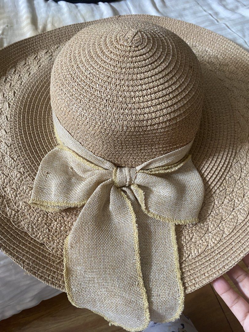 Wide Brim Straw Hat with Bow Detail (Category: Hats & Beanies) located in Santa Rosa. Submitted by intra_life4life (Listing ID 1459583282, Image 1). Description: - Classic straw hat with a wide brim for excellent sun protection. - Features a natural, woven texture for a chic look. - Adorned with a neutral-toned bow around the crown. - Ideal accessory for beach days, picnics, or everyday casual wear. - Lightweight and easy to pack for travel..