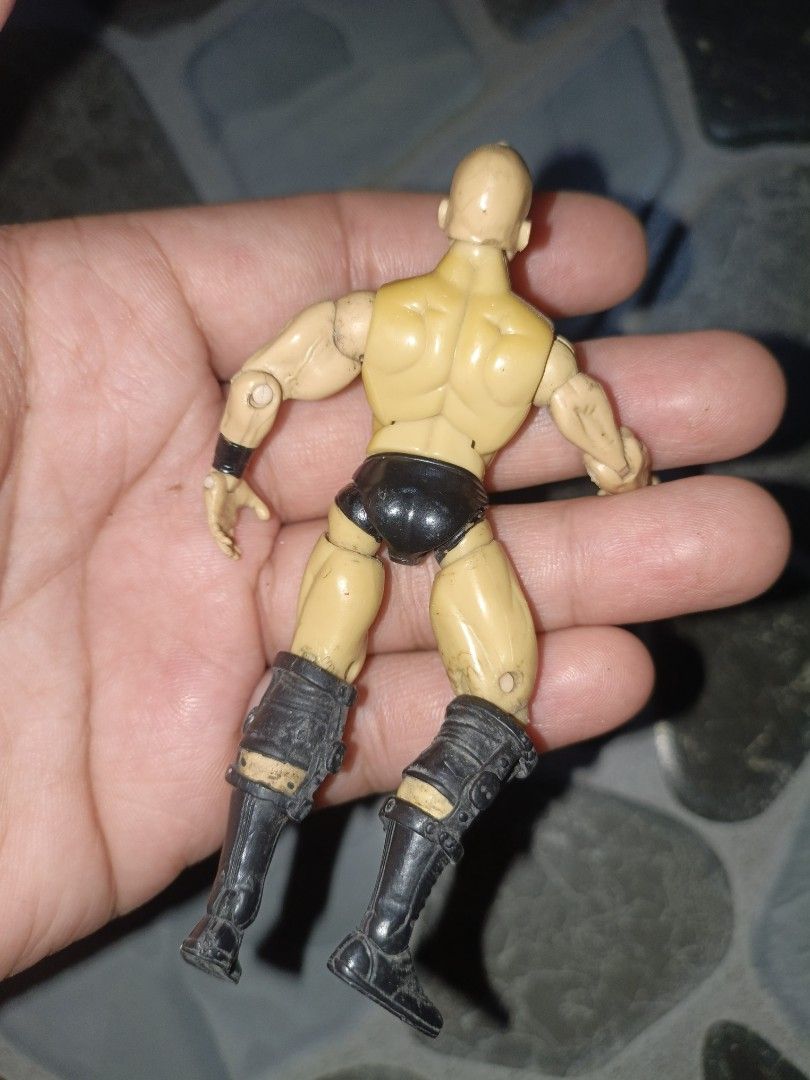 WWE Stone Cold Steve Austin Action Figure (Category: Figurines & Statues) located in Narvacan. Submitted by picky_looter (Listing ID 1459634373, Image 3). Description: - WWE Action Figure: Stone Cold Steve Austin - Size: Approximately 6 inches tall - Features: Fully articulated joints for dynamic posing - Condition: Minor scuffs on legs and boots - Ideal for: Wrestling fans and collectors.