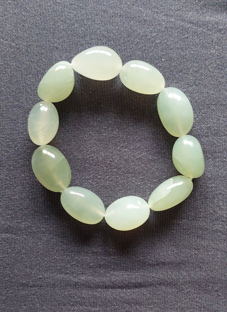 Xiuyu Jade Bracelet (Category: Bracelets) located in Gapan. Submitted by purseofjune (Listing ID 1459536567, Image 1). Description: 13mm beads, freeform customized wrist size.