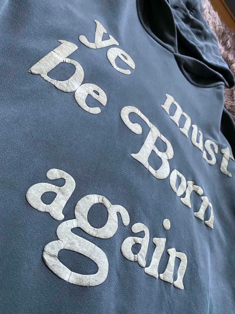 Ye must be born again ( authentic) (Category: Hoodies) located in Meycauayan. Submitted by _trip2thrift.bul (Listing ID 1459674999, Image 3). Description: CPFM born again hoodie boxy in size L. Coal colorway from the OG release (uses the thick Yeezy blank). Some minor cracks, discoloration, and chippage on the puff print. Judge condition by photos. 29x28 boxy type .