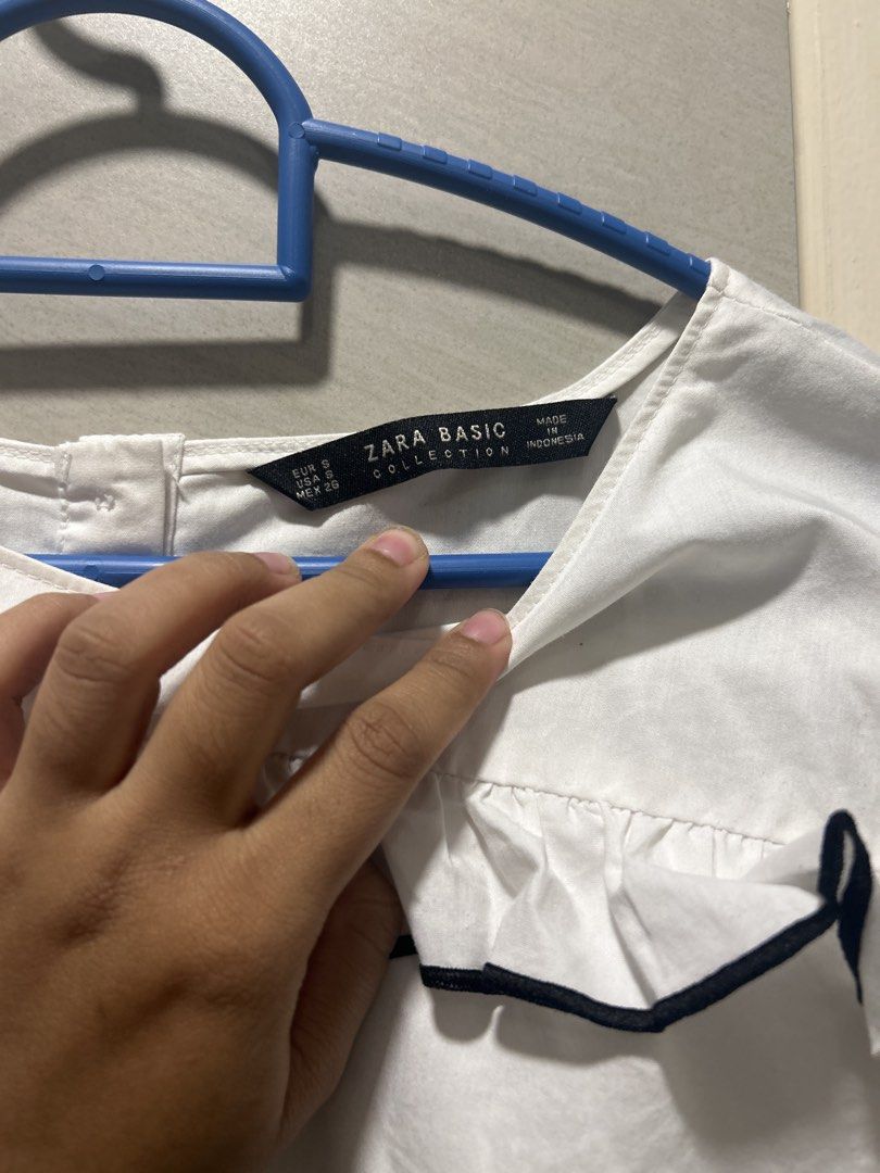 Zara Basic White Ruffle Top (Category: Blouses) located in Subang Jaya. Submitted by relivecorner. (Listing ID 1459617653, Image 3). Description: - Never wore much - Just need some ironing and it will be just fine -9/10 condition ~~~ - PREFER PICKUP / MEET-UP - PRICE IS NOT INCLUDED WITH POSTAGE - ADDITIONAL (RM10) FOR POSTAGE !.