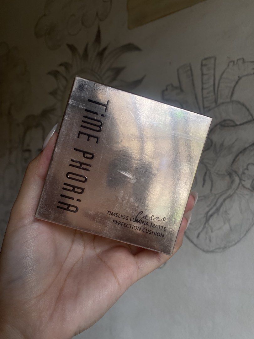 06 Cacao TIMEPHORIA Matte Cushion (Category: Makeup) located in Manila. Submitted by wisetiger_f8bc23 (Listing ID 1459704167, Image 3). Description: - brand new, sealed - TIME PHORIA Cushion Foundation - Shade: 06 Cacao - Formula: Timeless Lumina Matte Perfection - Finish: Matte - Condition: Comes in original packaging.