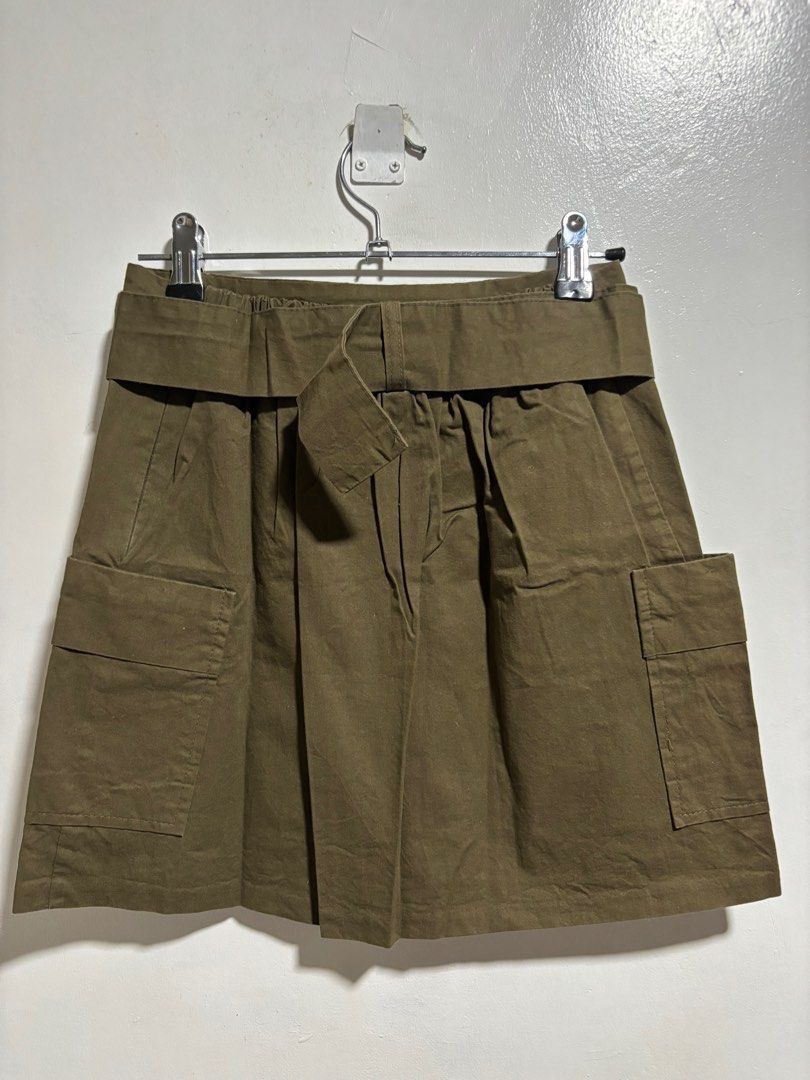 3.3 Field Trip Cargo Skirt (Category: Skirts) located in Cavite. Submitted by aceepreeloved (Listing ID 1459786217, Image 2). Description: - Olive green cargo skirt - Brand: 3.3 Field Trip - Features: Wide waistband with buckle, two front pockets - Material: Cotton with black lining - Origin: Korea - Care: Hand wash cold, do not bleach, do not dry clean Size: Small best fit Waist: 12 in Hips: 15.5 in Length: 15 in (Note: Please know and check you