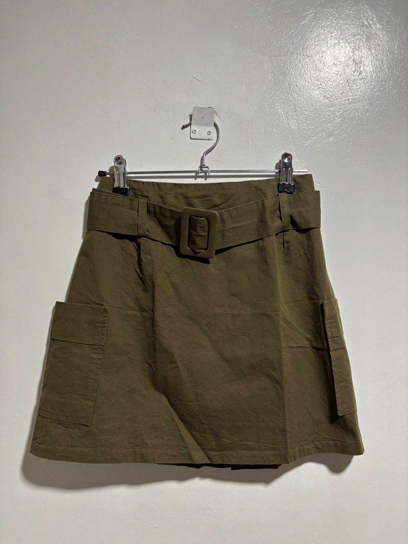 3.3 Field Trip Cargo Skirt (Category: Skirts) located in Cavite. Submitted by aceepreeloved (Listing ID 1459786217, Image 1). Description: - Olive green cargo skirt - Brand: 3.3 Field Trip - Features: Wide waistband with buckle, two front pockets - Material: Cotton with black lining - Origin: Korea - Care: Hand wash cold, do not bleach, do not dry clean Size: Small best fit Waist: 12 in Hips: 15.5 in Length: 15 in (Note: Please know and check you