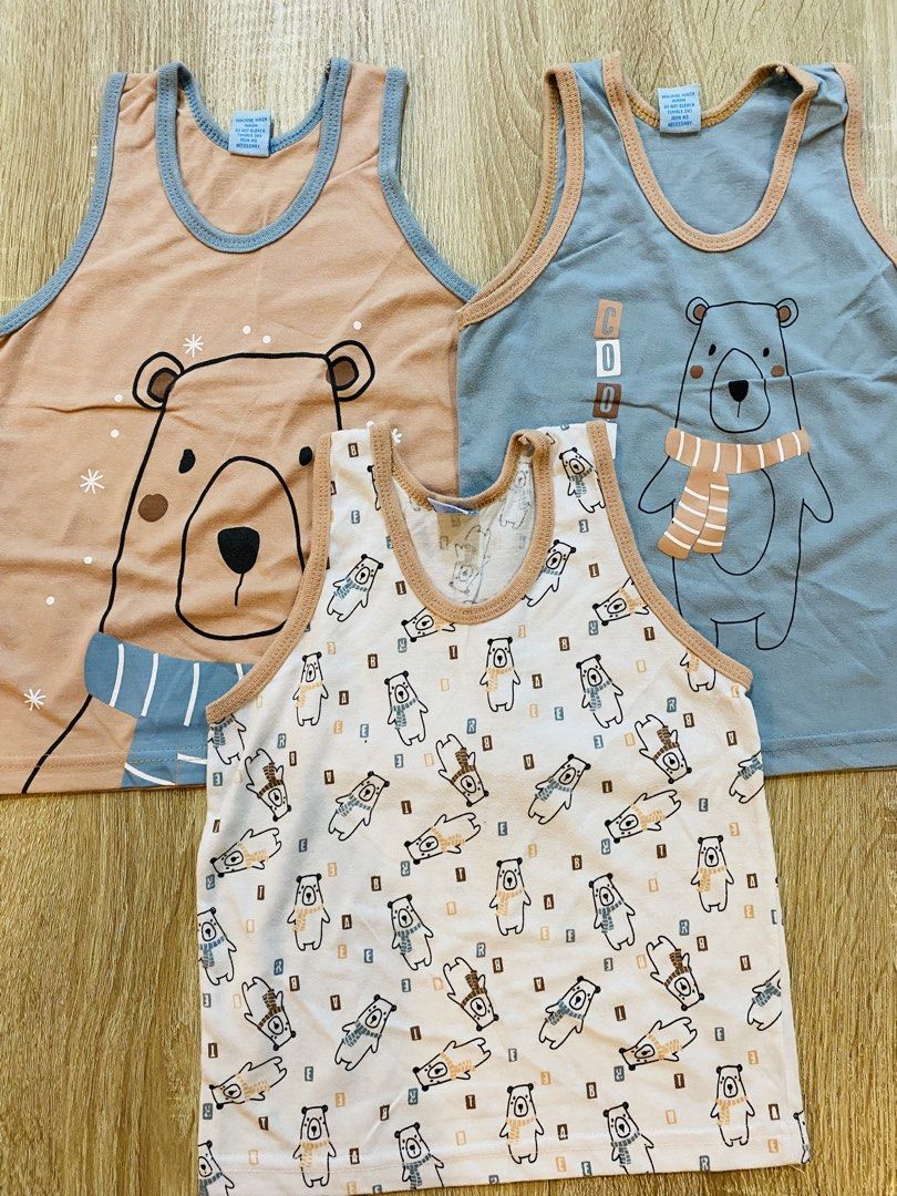 3 Pack Bear Print Kids' Tank Tops (Category: Babies & Kids Fashion) located in Indang. Submitted by matilde.sshop (Listing ID 1459888383, Image 1). Description: - Pack of 3 cute bear print tank tops for kids. - Designs include: large bear face, bear with scarf, and small bear pattern. - Ideal for everyday wear..