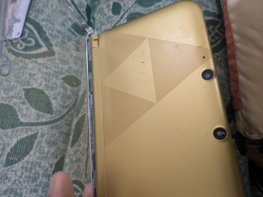 Modded 3DS XL A Link to the Past Edition (Category: Nintendo) located in Batangas. Submitted by Mr.Elyur (Listing ID 1459706132, Image 2). Description: Pm for more pics and condition Rfs: Upgrade. Condition: Front cam needs to be reseated or repaired or replaced, Qr code from fron cam works though. Very slight hinge loose, but fixed with the case. Scratches, sign of usages, a bit of spec in screen. Inclusion: Case Charger Original 64gb Sb card mo