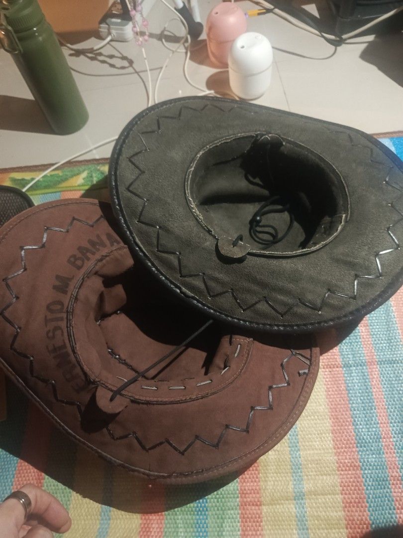 🤠 2-PIECE WESTERN / OUTBACK HAT SET (Category: Caps & Hats) located in Aparri. Submitted by jackdeclutter1111 (Listing ID 1459869048, Image 2). Description: ✨ Set Details 🟤 Brown Hat - Style: Wide-brim Western / Outback — soft suede-like fabric ​ - Features: Decorative zig-zag stitching, adjustable chin strap, inner sweatband with embroidered name ("Ernesto M. Banaag") — can be covered/removed ​ - Condition: Very good — minor wear, no tears, br