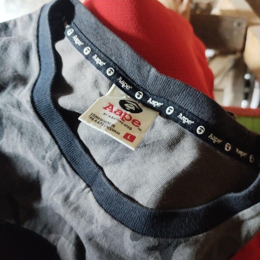 Aape tank top (Category: Tshirts & Polo Shirts ) located in Naga. Submitted by just_thrift2.0 (Listing ID 1459828344, Image 2). Description: large dimes 22x33 very good condition color rate 9.8/10 issue: minimal crack print / hindi masyadong visible.