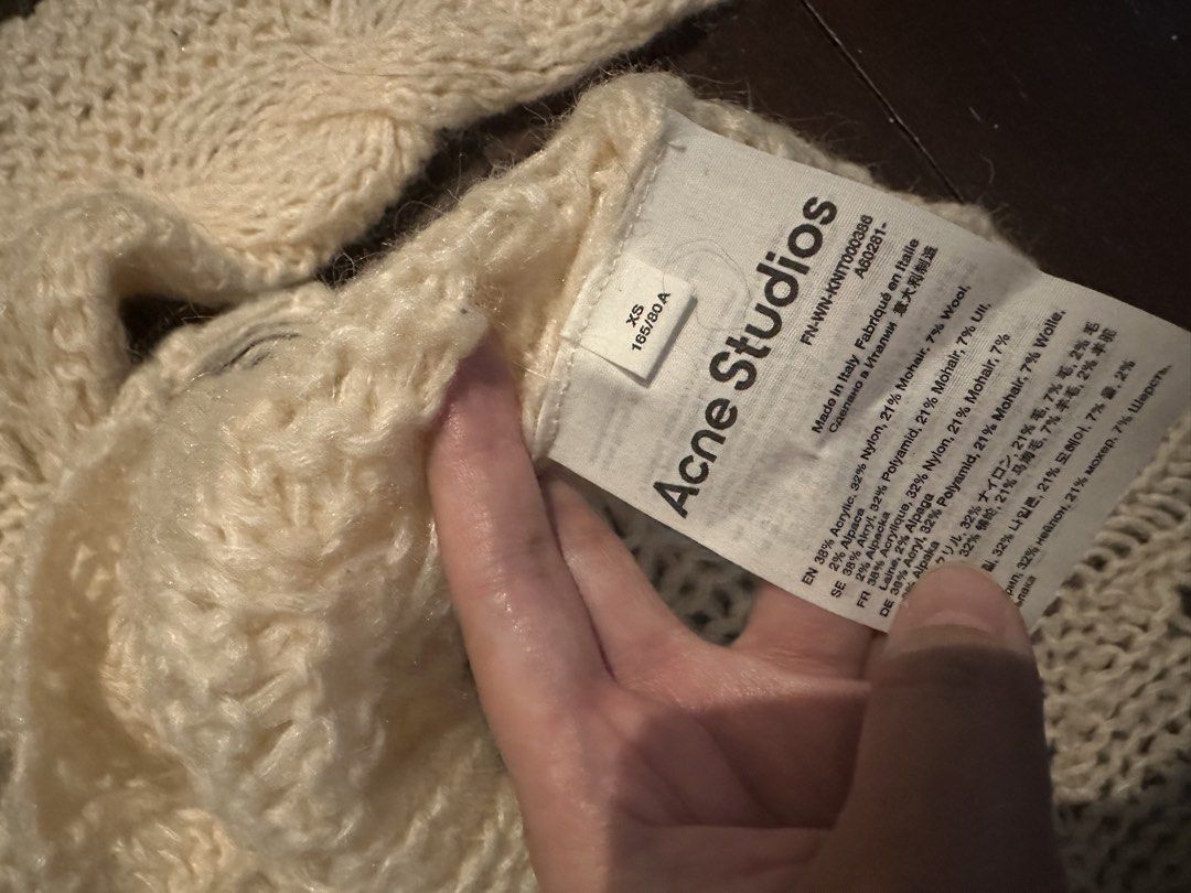 Acne Studios Sweater (Category: Longsleeves) located in Quezon City. Submitted by bernicet31 (Listing ID 1459732709, Image 3). Description: - Acne Studios cream knit sweater - Collared neckline with button closure - Intricate cable knit detailing - Loose, open knit construction - Ideal for layering.