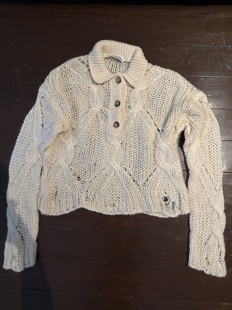 Acne Studios Sweater (Category: Longsleeves) located in Quezon City. Submitted by bernicet31 (Listing ID 1459732709, Image 1). Description: - Acne Studios cream knit sweater - Collared neckline with button closure - Intricate cable knit detailing - Loose, open knit construction - Ideal for layering.