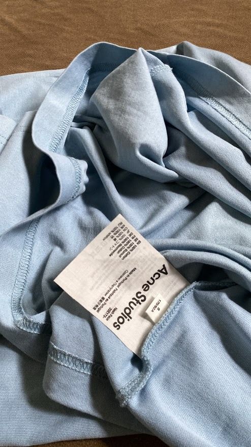 Acne Studios Tee (Category: Tshirts & Polo Shirts ) located in Quezon City. Submitted by maeee_99 (Listing ID 1459794179, Image 3). Description: - Authentic - 21 x 28 - Powder Blue - No issues.