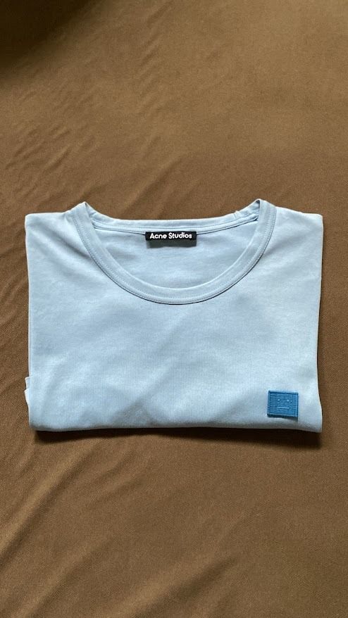 Acne Studios Tee (Category: Tshirts & Polo Shirts ) located in Quezon City. Submitted by maeee_99 (Listing ID 1459794179, Image 1). Description: - Authentic - 21 x 28 - Powder Blue - No issues.