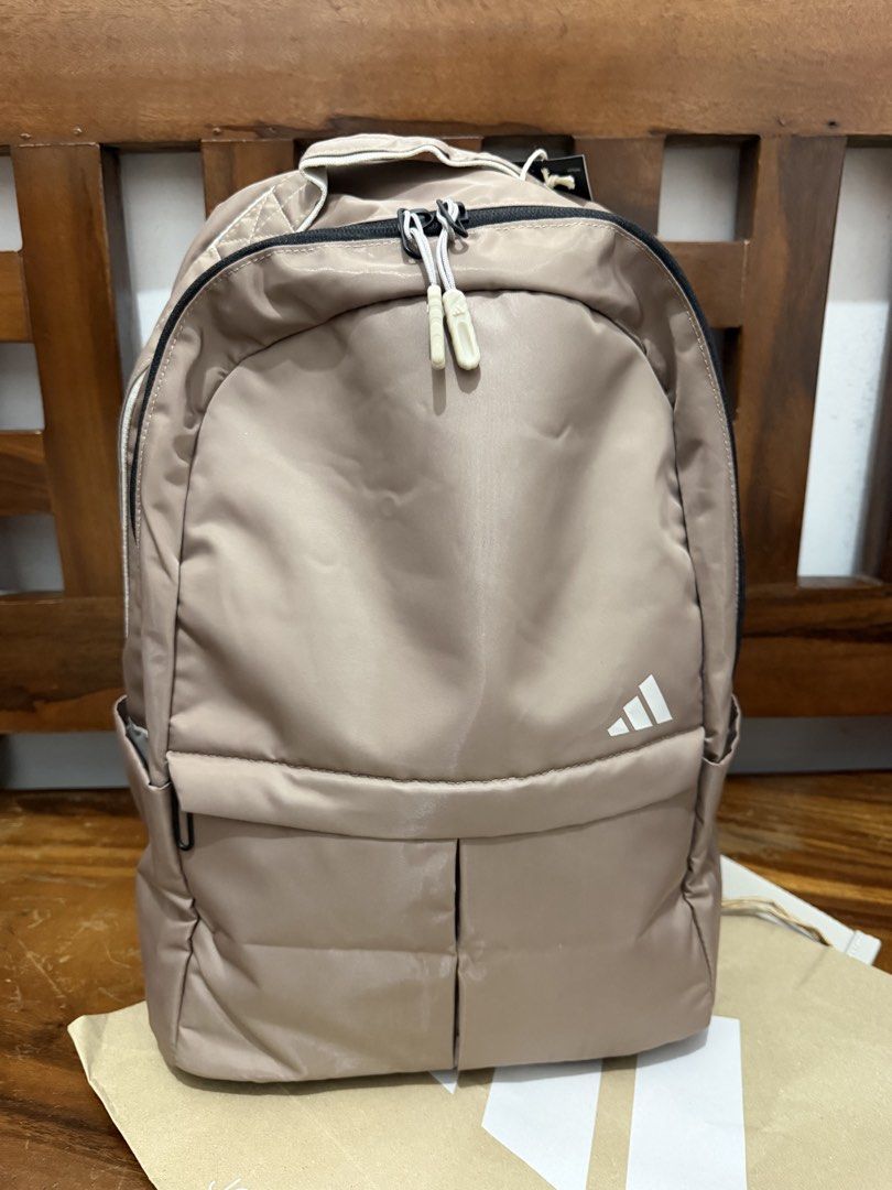 Adidas BP Backpack - Taupe (Category: Backpacks) located in Makati City. Submitted by petite_preloved2 (Listing ID 1459793240, Image 1). Description: - Can fit 16” laptop - Brand new Adidas backpack - Stylish taupe color - Main compartment for storage - Convenient front pocket - Padded straps for maximum comfort - Original tags still attached.