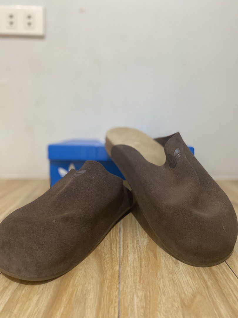 Adidas Brown Clogs (Category: Slippers & Slides) located in Paranaque City. Submitted by mr2kive (Listing ID 1459719916, Image 1). Description: ‼️NON-NEGOTIABLE‼️ - Brand: Adidas - Type: Brown Suede Slides - Size: US 10 / UK 9.5 - Condition: Comes with original box - Ideal for: Casual wear RFS: marami na pong clogs father ko and decluttering .