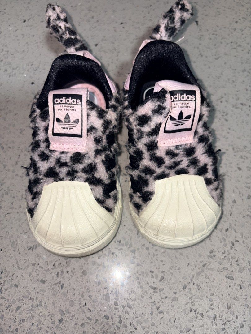 Adidas Superstar 360 Shoes Leopard Print (Category: Babies & Kids Fashion) located in Dasmarinas. Submitted by the_zoneshop.ph (Listing ID 1459788072, Image 1). Description: - Adorable Adidas Superstar crib shoes for babies and toddlers. - Features a fun and trendy leopard print. - Cozy fuzzy texture for ultimate comfort. - Iconic shell toe design. - Convenient slip-on style for easy wear. - US5K, CHN 115.